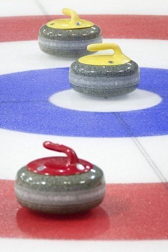 Curling stones are shown in play during a test event at the Olympic Curling Centre in Adler, Russia on February 21, 2013